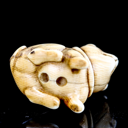 211 - A Japanese ivory netsuke in the form of a dog, in the manner of Ohara Mitsuhiro, unsigned, height 2.... 