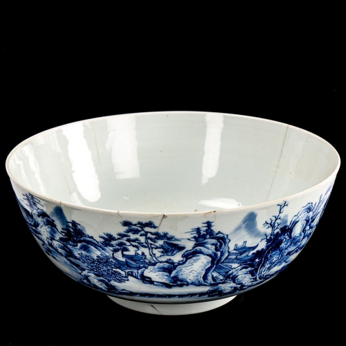 215 - A Chinese blue and white porcelain bowl, painted landscape decoration and carp interior, diameter 26... 