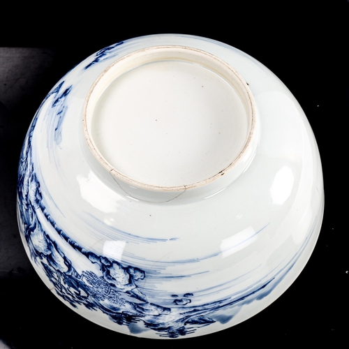 215 - A Chinese blue and white porcelain bowl, painted landscape decoration and carp interior, diameter 26... 