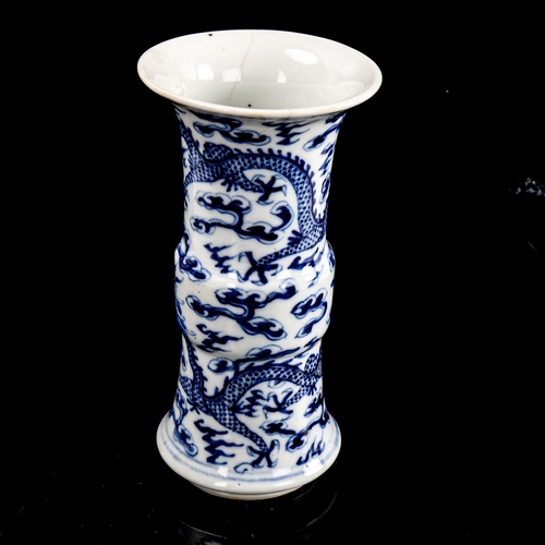 217 - A Chinese blue and white porcelain sleeve vase, 4 character mark, height 15cm, and a blue and white ... 