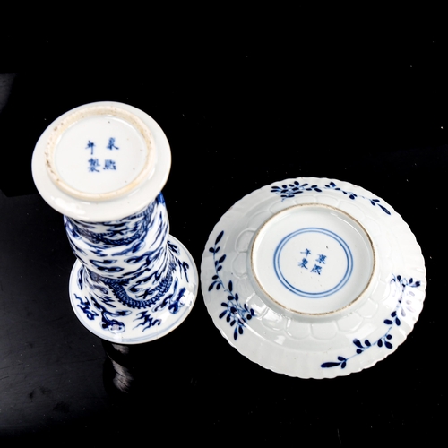 217 - A Chinese blue and white porcelain sleeve vase, 4 character mark, height 15cm, and a blue and white ... 