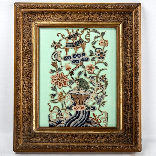 219 - A Chinese embroidered panel on green paper backing, framed, overall frame dimensions 35cm x 30cm