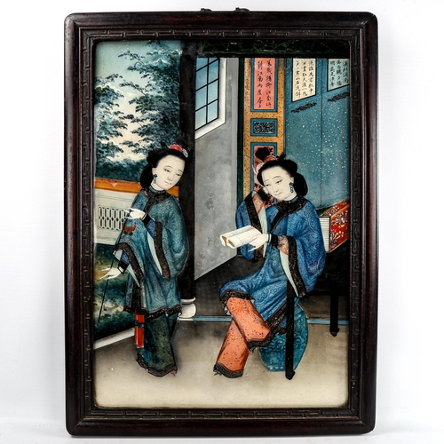 220 - A Chinese reverse painting behind glass, depicting 2 women in an interior, hardwood frame, overall f... 