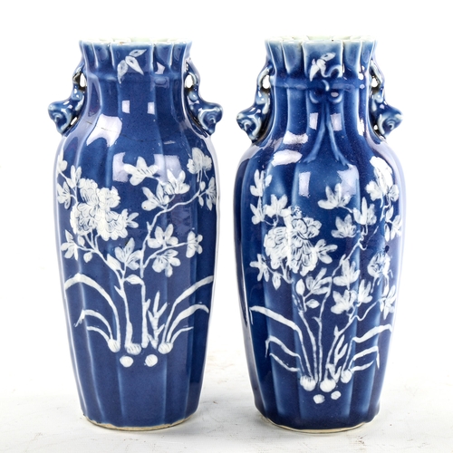 223 - A pair of Chinese blue glaze porcelain vases, with floral decoration, height 24cm