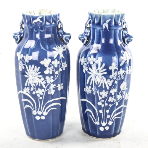 223 - A pair of Chinese blue glaze porcelain vases, with floral decoration, height 24cm