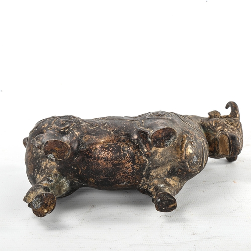 234 - A gilt patinated bronze bull, with relief moulded surface decoration, length 18cm