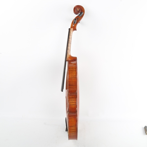 240 - An Antique violin, late 19th/early 20th century, retailed by London Violin Co Limited, bearing Strad... 