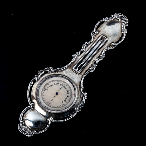 253 - An unusual miniature silver-cased banjo-shaped barometer and thermometer, with cast surround, length... 