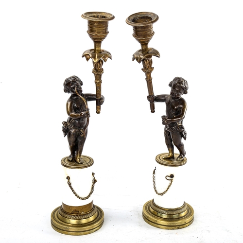 261 - A pair of French bronze and ceramic cherub design candle holders, height 30cm