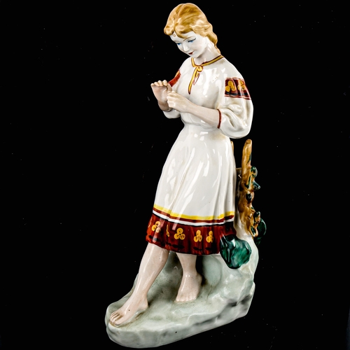 269 - A Russian porcelain figure of a girl, height 29cm