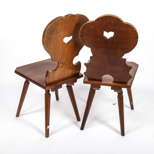 156 - A pair of German Brettstuhl / Tyrolean chairs by Hans Thoma of Bernau, with relief carved backs depi... 