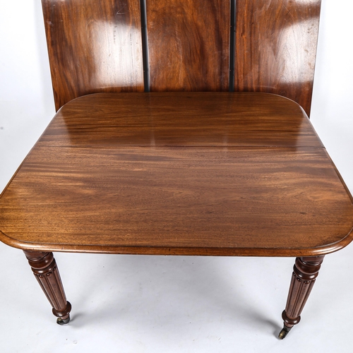 280 - A 19th century mahogany wind-out dining table, with turned and reeded legs, and 3 spare leaves