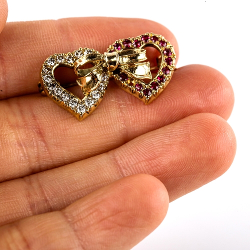 616 - A late 20th century 18ct gold ruby and diamond double-heart brooch, set with round-cut rubies and mo... 