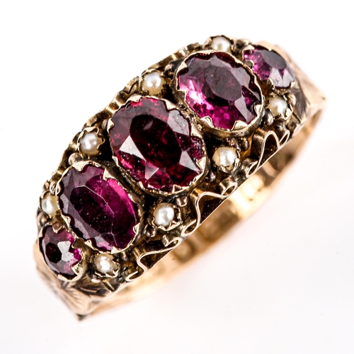 617 - A Victorian 9ct gold garnet and pearl half hoop ring, set with oval mixed-cut garnets and floral eng... 