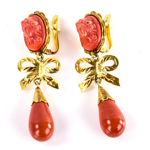 619 - A pair of faux composition coral drop earrings, unmarked gold settings with relief female cameos and... 