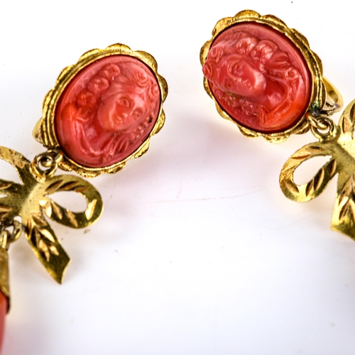 619 - A pair of faux composition coral drop earrings, unmarked gold settings with relief female cameos and... 