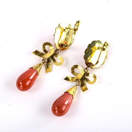 619 - A pair of faux composition coral drop earrings, unmarked gold settings with relief female cameos and... 