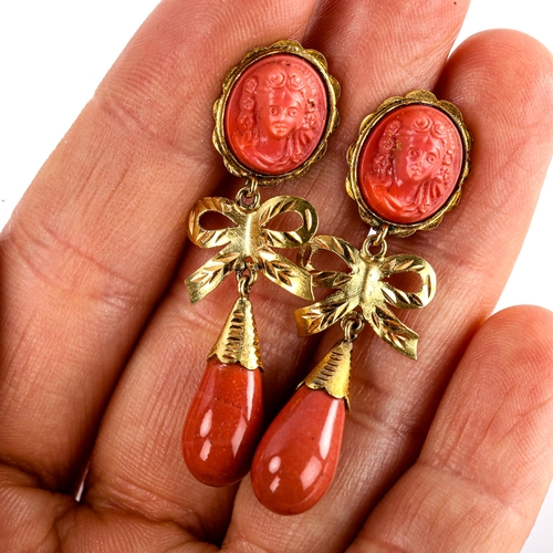 619 - A pair of faux composition coral drop earrings, unmarked gold settings with relief female cameos and... 