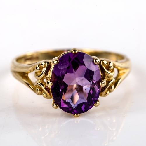 623 - A modern 9ct gold amethyst dress ring, set with oval mixed-cut amethyst and openwork shoulders, sett... 