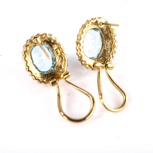 625 - A modern pair of 9ct gold blue topaz and diamond cluster earrings, with English lock fittings, setti... 