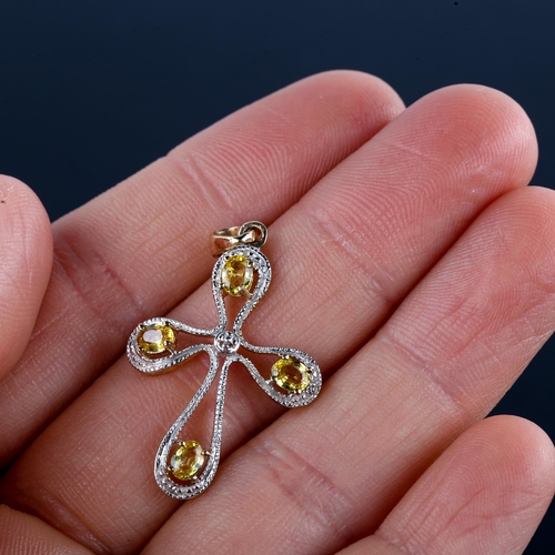 630 - A modern 9ct gold yellow apatite modernist cross pendant, pendant height excluding bale 29.8mm, 1.8g