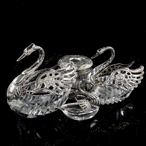 634 - A graduated set of 3 silver-mounted cut-glass swan table salts, and a silver-mounted glass dressing ... 