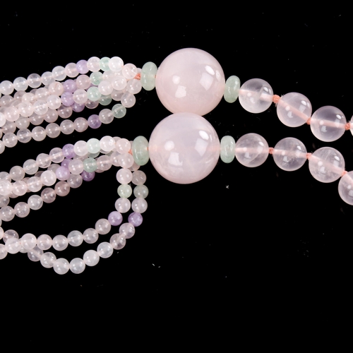 642 - A polished rose quartz jade and amethyst bead necklace, necklace length 76cm, 124.7g