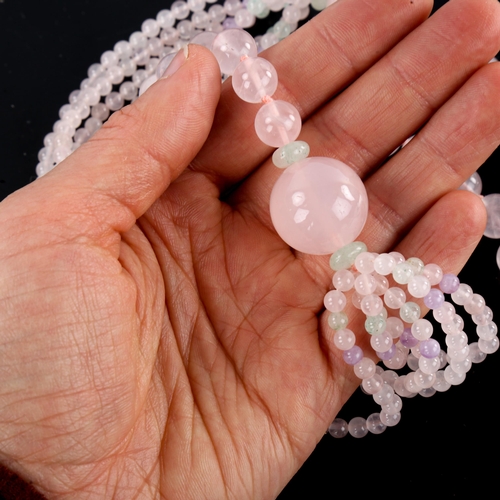 642 - A polished rose quartz jade and amethyst bead necklace, necklace length 76cm, 124.7g