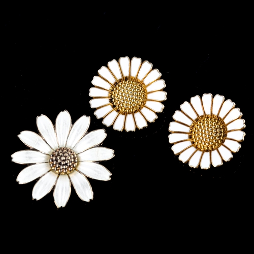 654 - BERNHARD HERTZ - a pair of Danish vermeil sterling silver and white enamel daisy pattern clip-on ear... 