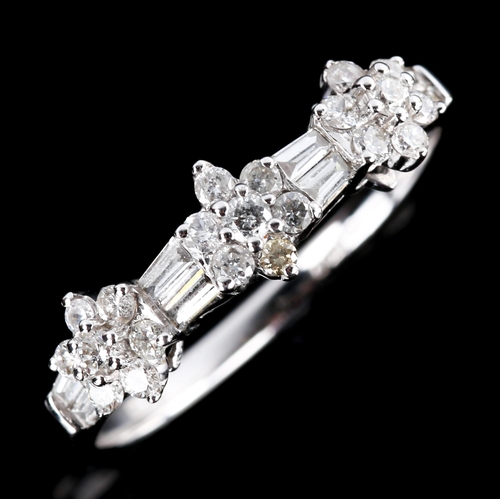 668 - A modern 18ct white gold diamond triple-cluster flowerhead dress ring, set with round brilliant and ... 