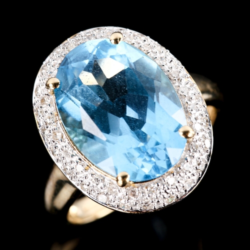 670 - A large modern 9ct gold blue topaz and diamond oval cluster ring, set with oval mixed-cut topaz and ... 