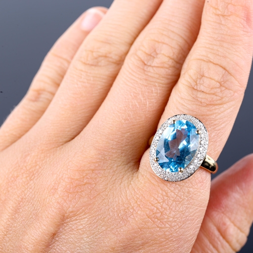 670 - A large modern 9ct gold blue topaz and diamond oval cluster ring, set with oval mixed-cut topaz and ... 