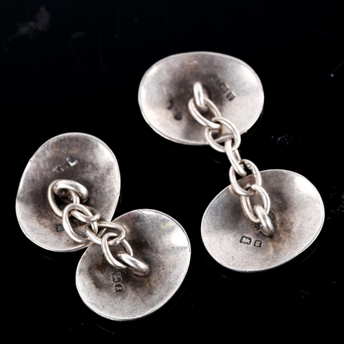 671 - A pair of early 20th century silver oval cufflinks, engraved floral decoration, by George Loveridge,... 