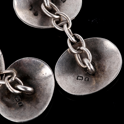 671 - A pair of early 20th century silver oval cufflinks, engraved floral decoration, by George Loveridge,... 