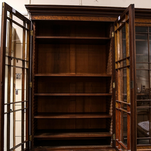 203 - A large fine George III plum pudding mahogany library bookcase, with 4 lattice glazed cabinets above... 