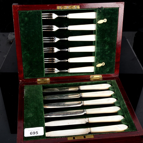 695 - A George V silver-bladed mother-of-pearl handled dessert cutlery set for 6 people, by Lee & Wigfull,... 