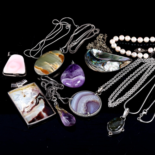 706 - Various modern silver and gem set pendants