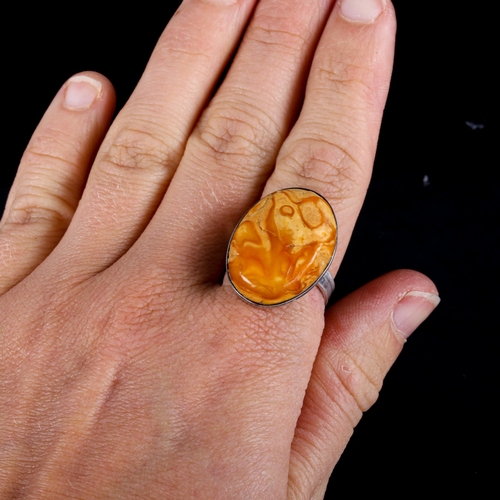 711 - Various Danish Baltic and butterscotch amber jewellery, including rings, pendant and brooch, 34.9g g... 