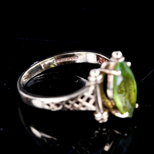 728 - A late 20th century 9ct gold marquise peridot dress ring, with pierced lattice shoulders, hallmarks ... 