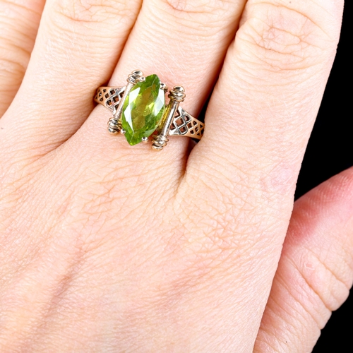 728 - A late 20th century 9ct gold marquise peridot dress ring, with pierced lattice shoulders, hallmarks ... 