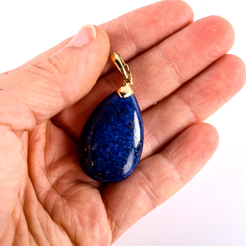 737 - A modern 9ct gold polished teardrop lapis lazuli pendant, pendant height 45mm, 10.2g