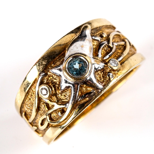 740 - A modern 9ct yellow and white gold blue topaz and diamond abstract band ring, setting height 9.9mm, ... 