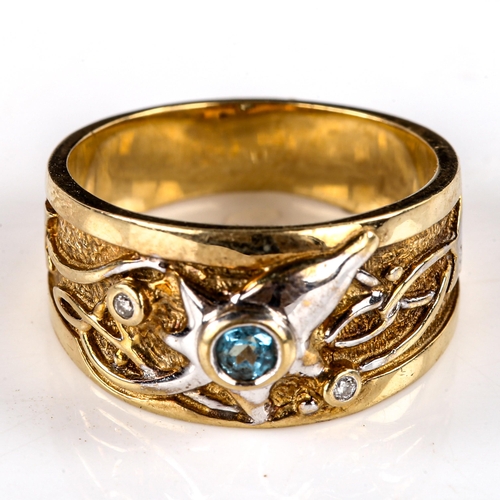 740 - A modern 9ct yellow and white gold blue topaz and diamond abstract band ring, setting height 9.9mm, ... 