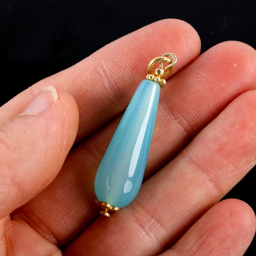 741 - A modern polished blue agate teardrop pendant, with unmarked yellow metal mounts, height excluding b... 