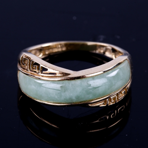 743 - A modern 9ct gold jade dress ring, with pierced Greek key shoulders, setting height 7.8mm, size M, 2... 