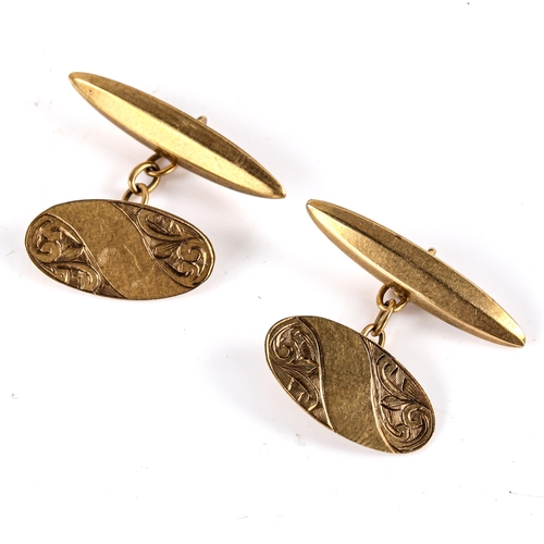 744 - A pair of early 20th century 9ct gold oval panel cufflinks, engraved foliate decoration, hallmarks B... 