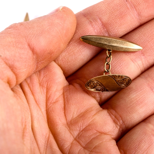 744 - A pair of early 20th century 9ct gold oval panel cufflinks, engraved foliate decoration, hallmarks B... 