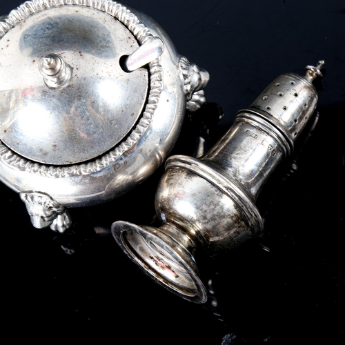 754 - A George V silver mustard pot, with lion paw feet and blue glass liner, hallmarks London 1922, and a... 