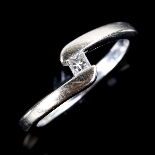 761 - A modern 9ct white gold 0.1ct Princess-cut diamond crossover ring, size M, 2.9g