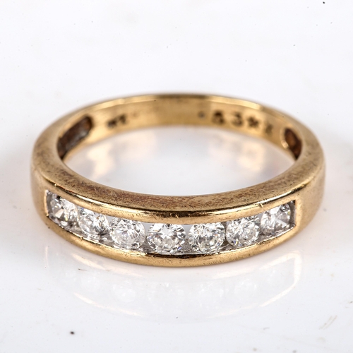 762 - A modern 9ct gold 7-stone diamond half eternity ring, channel set with modern round brilliant-cut di... 